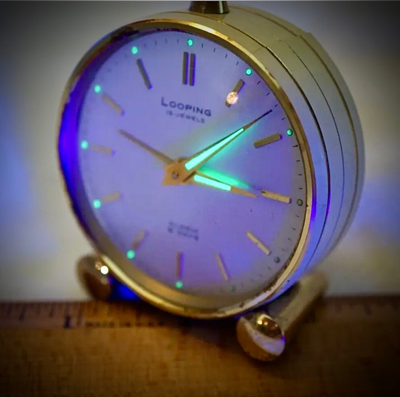 R75. VTG LOOPING 15 JEWELS 8 DAY SWISS TRAVEL ALARM CLOCK BRASS W/FACE & WHITE BODY