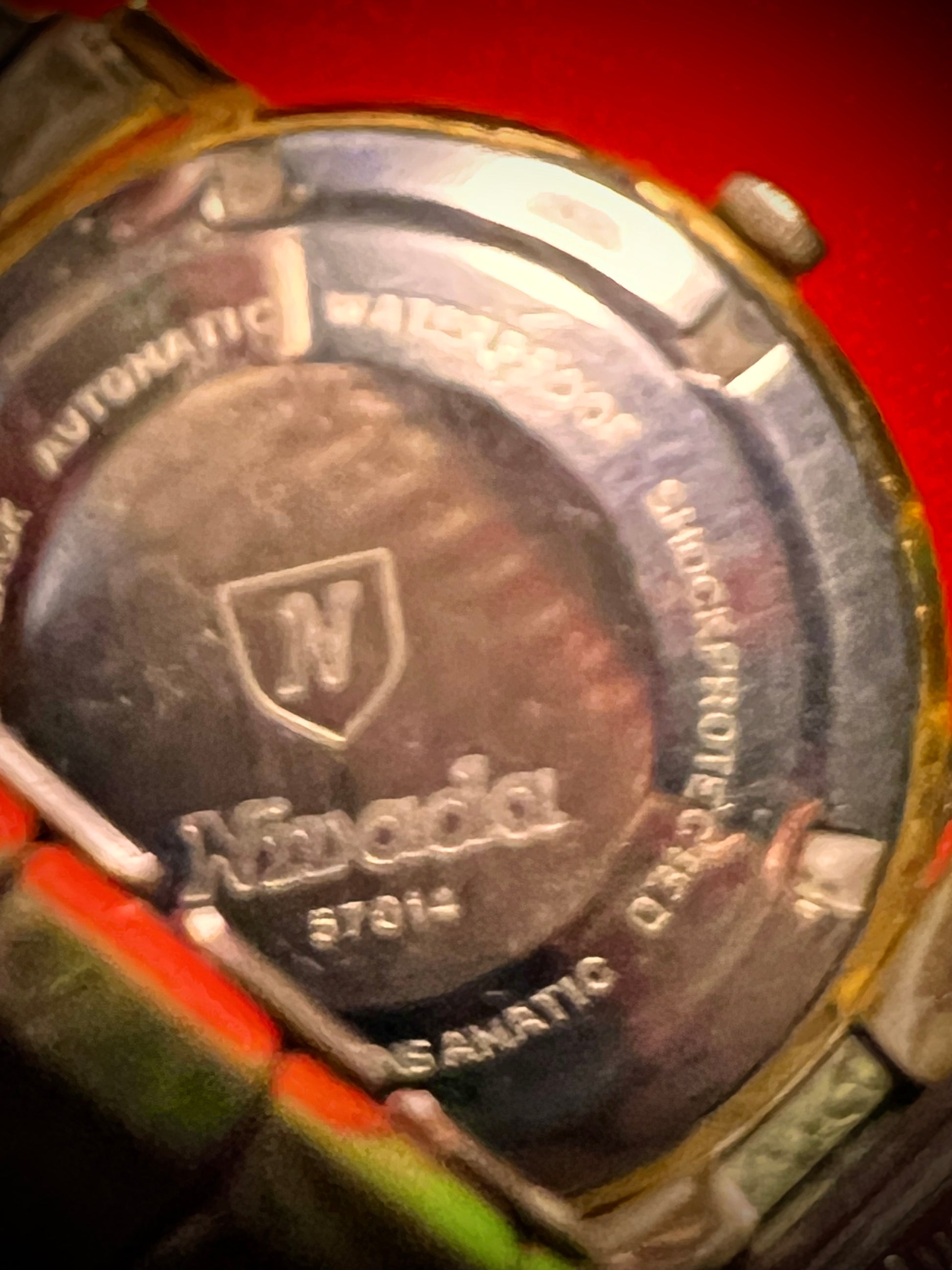 #1351 Nivada Date Automatic Gold color with Gold dial newish beautiful S.S back Spidiel USA gold filled caps all original watch great opportunity for Collectors rate watch in excellent running and beautiful condition. Power 266 beat error 0.1 ms