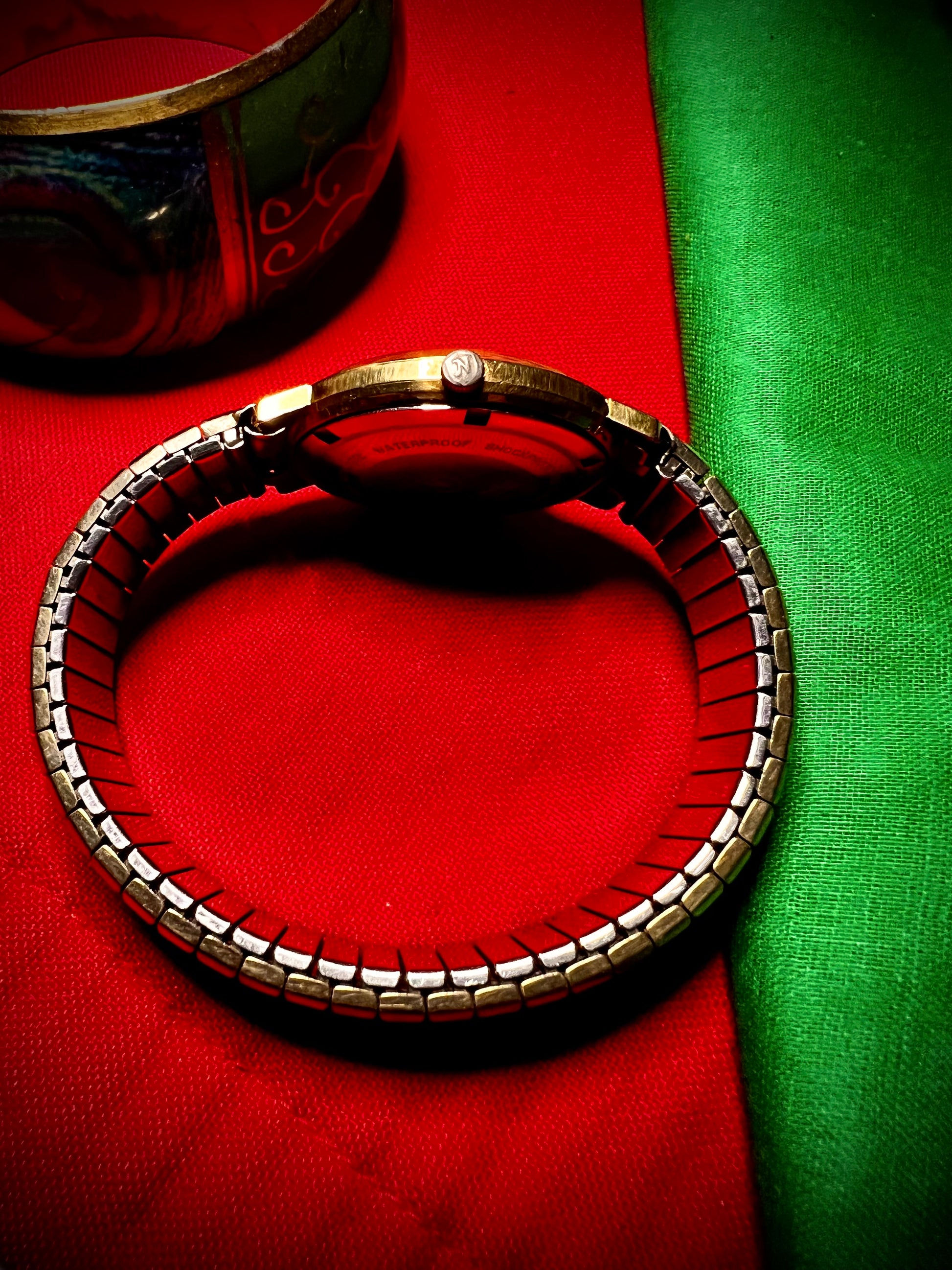 #1351 Nivada Date Automatic Gold color with Gold dial newish beautiful S.S back Spidiel USA gold filled caps all original watch great opportunity for Collectors rate watch in excellent running and beautiful condition. Power 266 beat error 0.1 ms