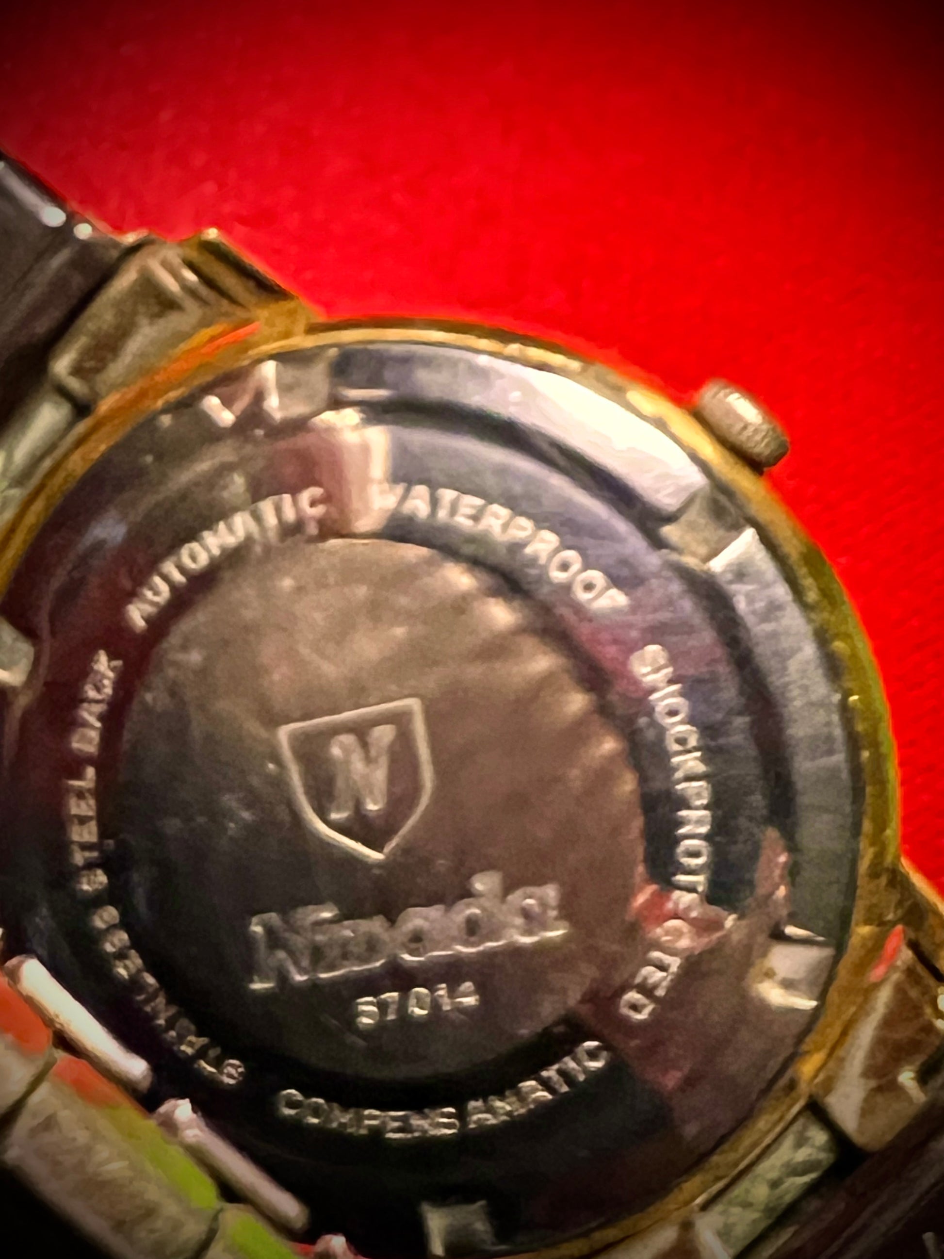 #1351 Nivada Date Automatic Gold color with Gold dial newish beautiful S.S back Spidiel USA gold filled caps all original watch great opportunity for Collectors rate watch in excellent running and beautiful condition. Power 266 beat error 0.1 ms