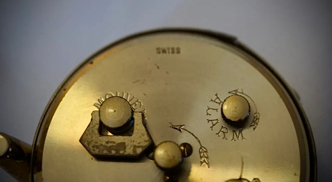 R75. VTG LOOPING 15 JEWELS 8 DAY SWISS TRAVEL ALARM CLOCK BRASS W/FACE & WHITE BODY