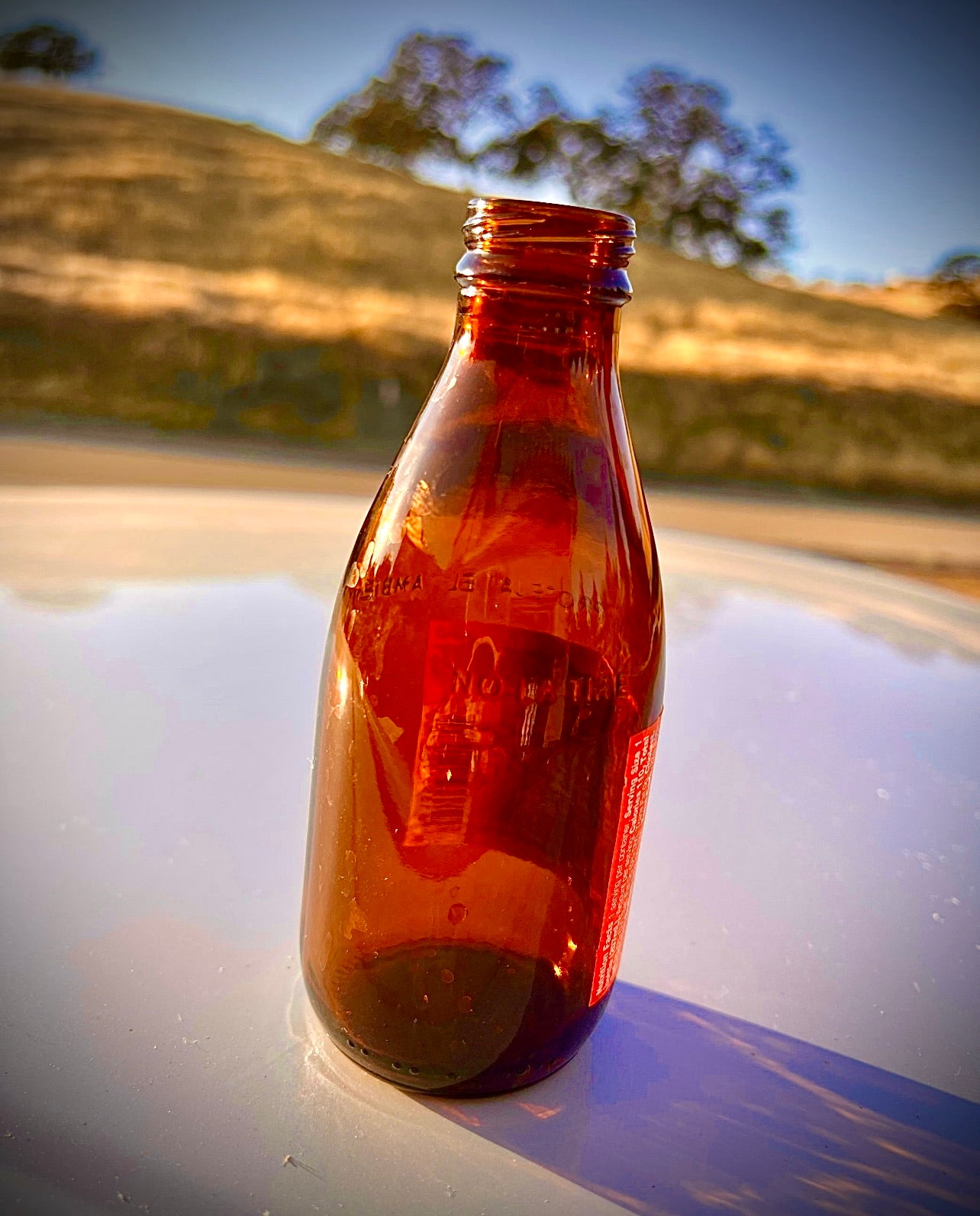 27 amber Clean empty Glass bottles for liquids, refilling, and Glass projects.