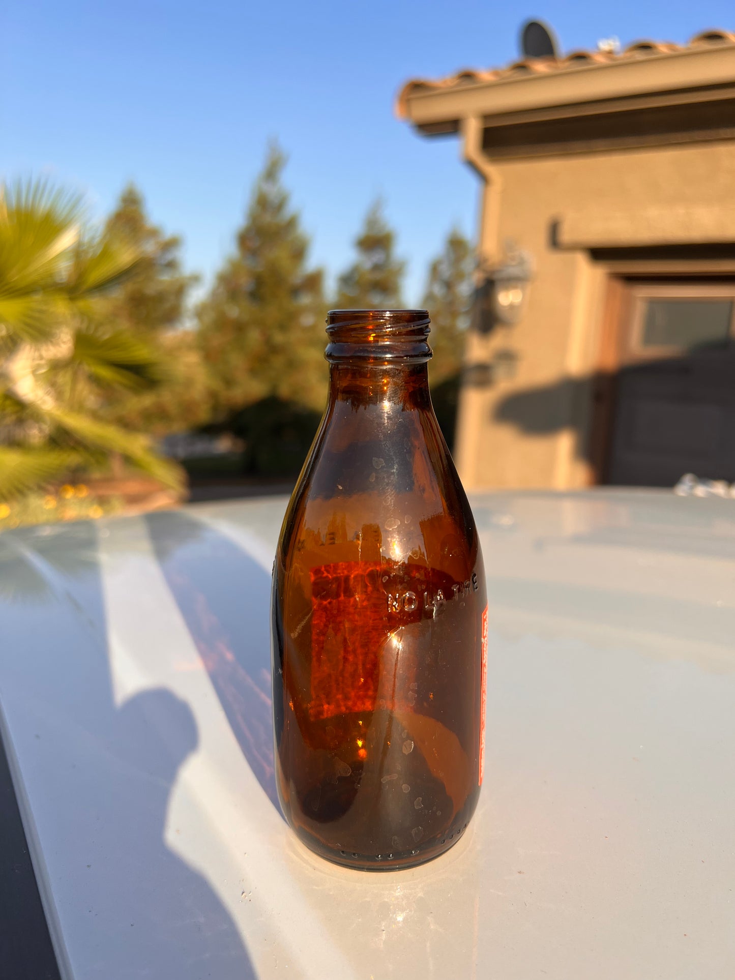 27 amber Clean empty Glass bottles for liquids, refilling, and Glass projects.