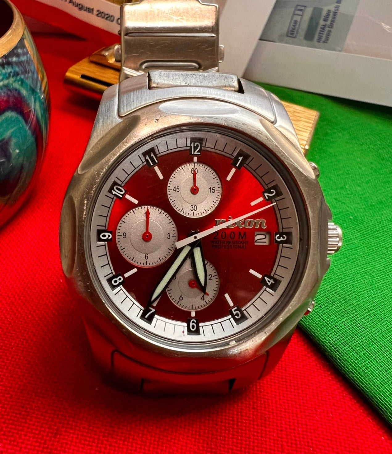 #320 Nixon Beautiful red Dial Quartz Chrinometer 200 Meter Heavy Watch With Original Bracelet