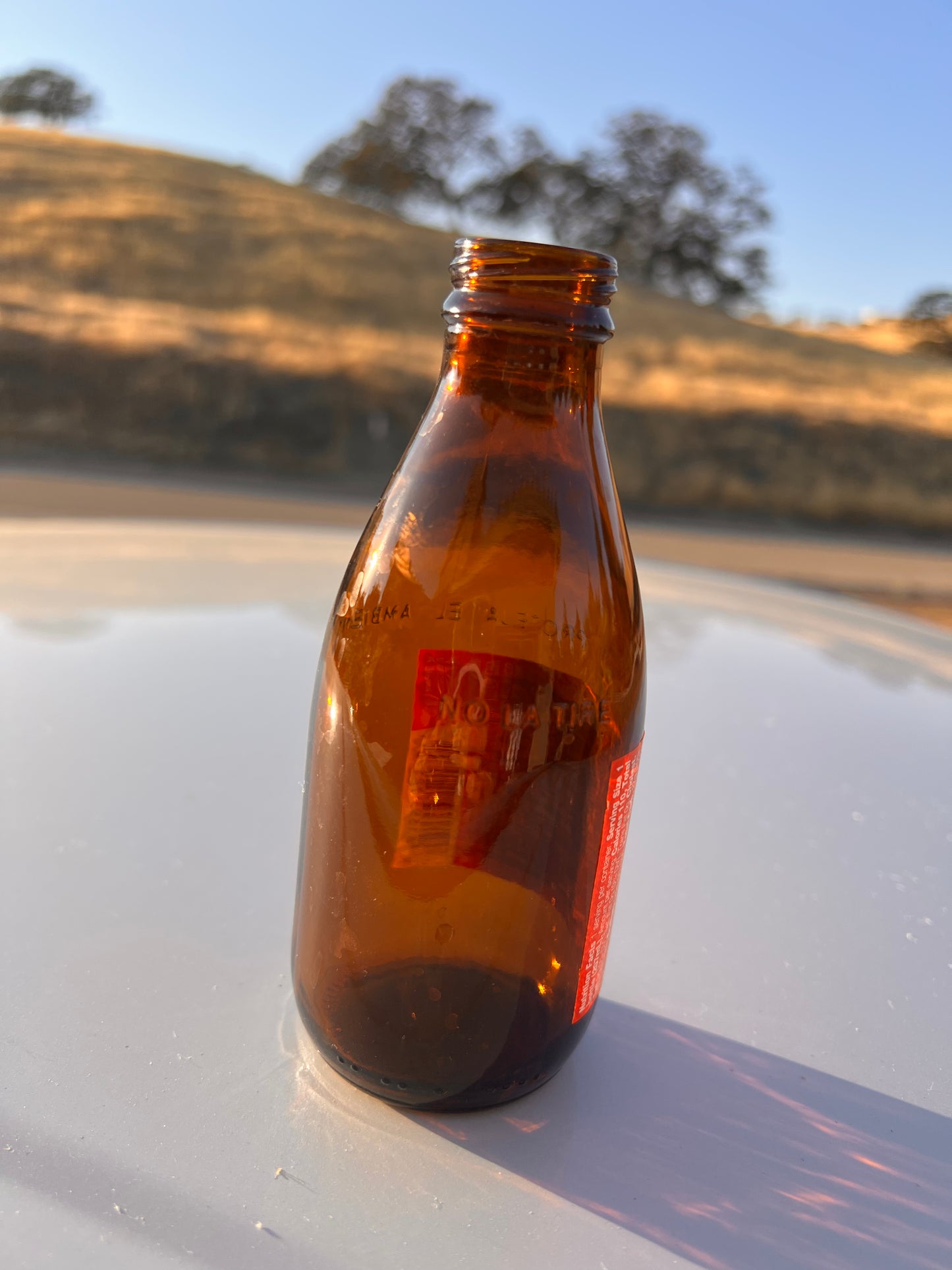 27 amber Clean empty Glass bottles for liquids, refilling, and Glass projects.